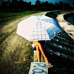 евгенийфёдоров: a man under an umbrella, an umbrella glows with radioactive  light