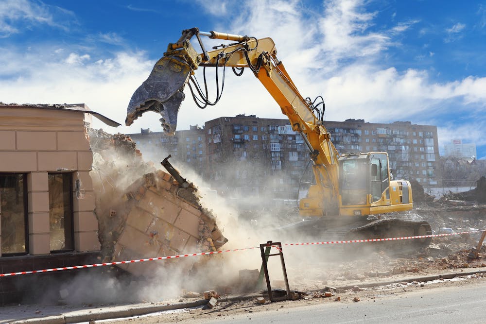 Why might a building unexpectedly collapse during demolition work?