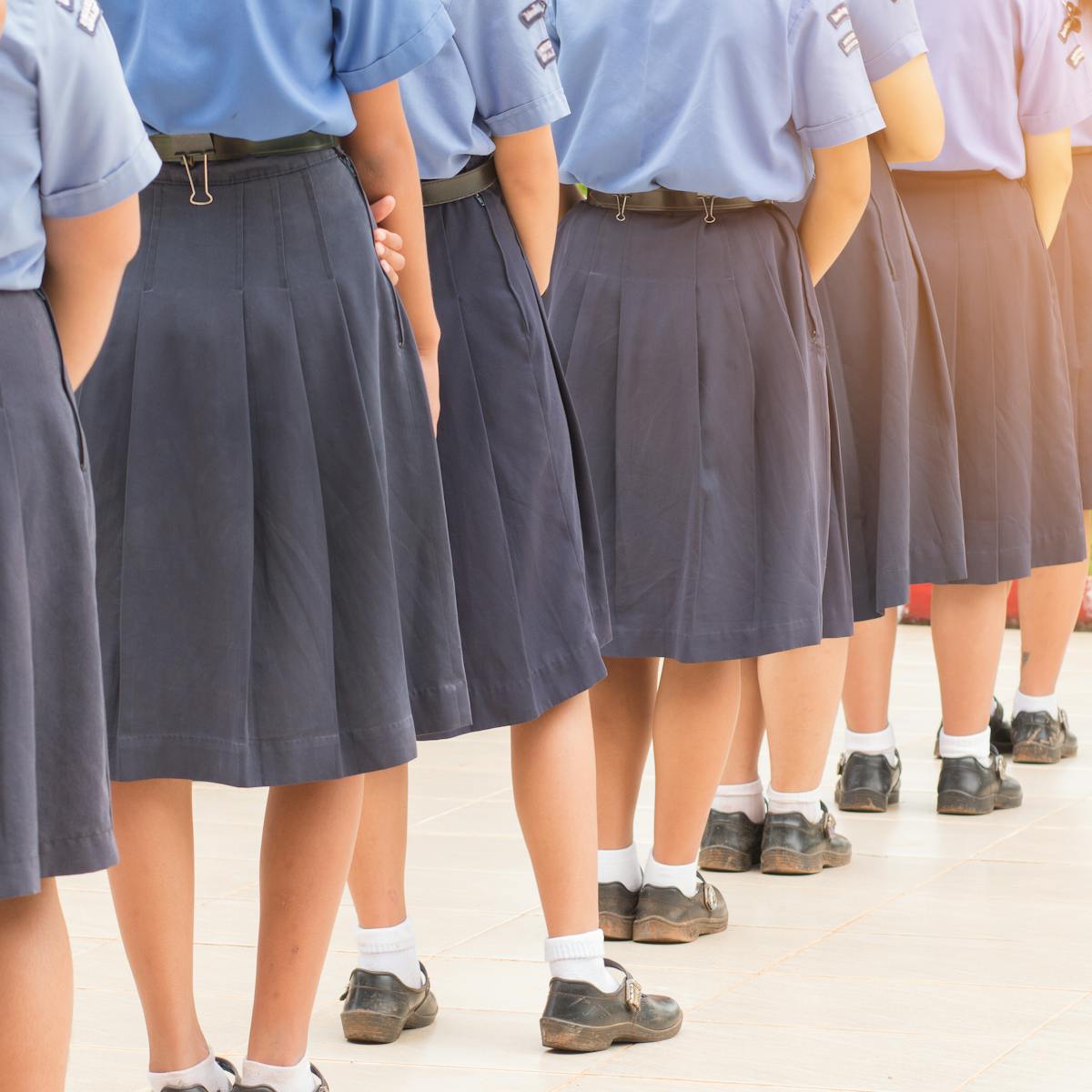 Why do we still make girls wear skirts and dresses as school uniform?