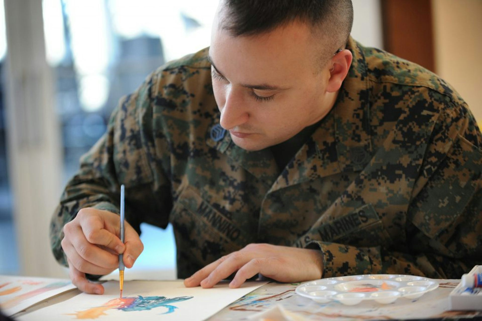 How Using Paint Pen On Paper Or Song To Revisit Trauma Helps Us