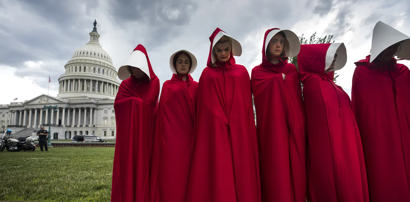 red dress white hat show The Handmaids Tale reveals how fashion can be weaponised in an authoritarian society, from the indentured servants red cloaks to the submissive wives teal dresses. They arent just costumes,