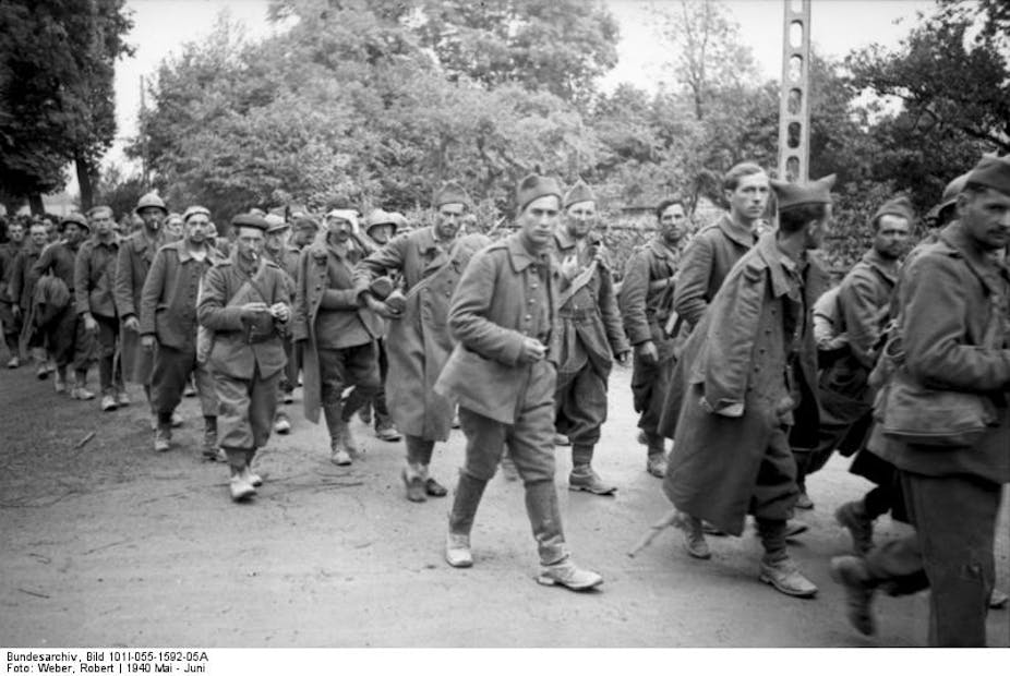 French POWs being led away from the battlefield in May 1940