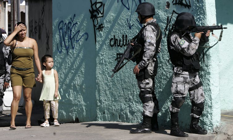 Death toll mounts in Rio de Janeiro as police lose control of the city – and of themselves