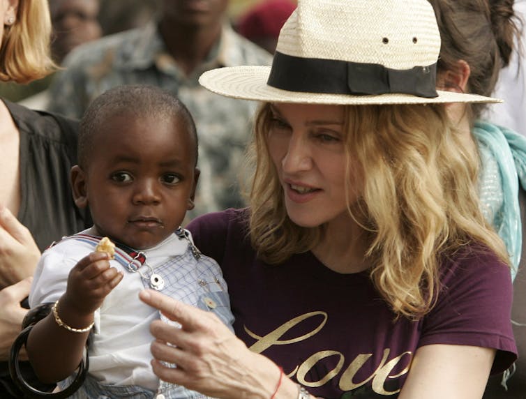 Madonna with her adopted son, David Banda, at an orphanage, 40 km from the capital Lilongwe April 19, 2007. Siphiwe Sibeko/Reuters