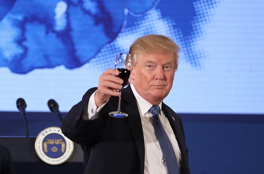 Image result for   U.S. President Donald Trump raises his glass in a toast at the start of a dinner in Seoul, South Korea. (AP Photo/Andrew Harnik)