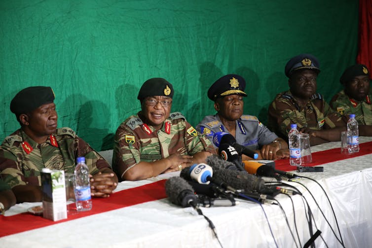 Zimbabwe National Army commander Constantino Chiwenga, second from left, addressing the media. EPA-EFE/Aaron Ufumeli