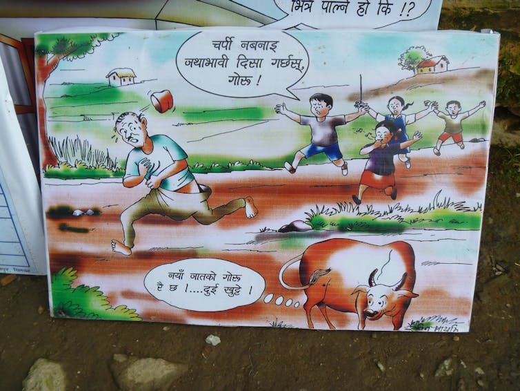 A banner in a Nepali village promoting safe sanitation, as open defecation is ‘only for cows’. Author's own
