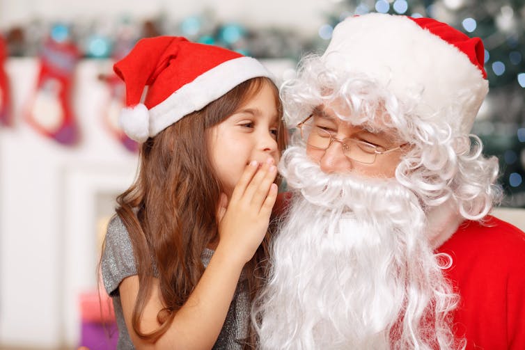 Santa Claus and child on lap