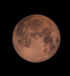 A super blood moon tinted red by scattered light. GSFC, CC BY