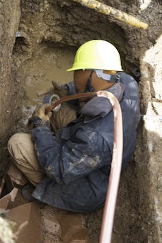 Michigan says Flint water is safe to drink, but residents' trust in government has corroded