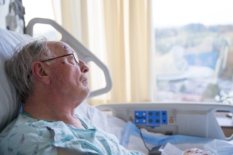 man in a hospital bed