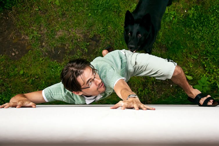 Man struggling on the ground. Dmitri Ma/Shutterstock.com