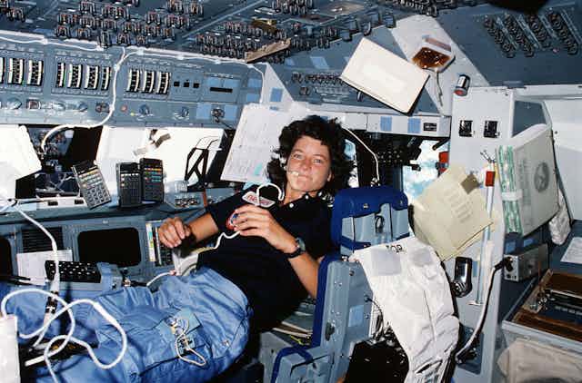 woman in zero gravity in space shuttle