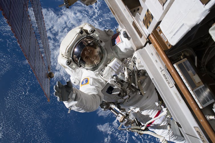 International Space Station astronaut Ricky Arnold doing a spacewalk