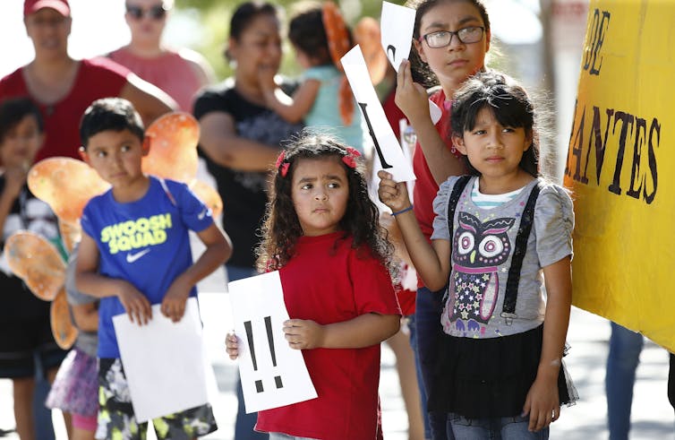 Children at an immigrant family separation protest in Phoenix.