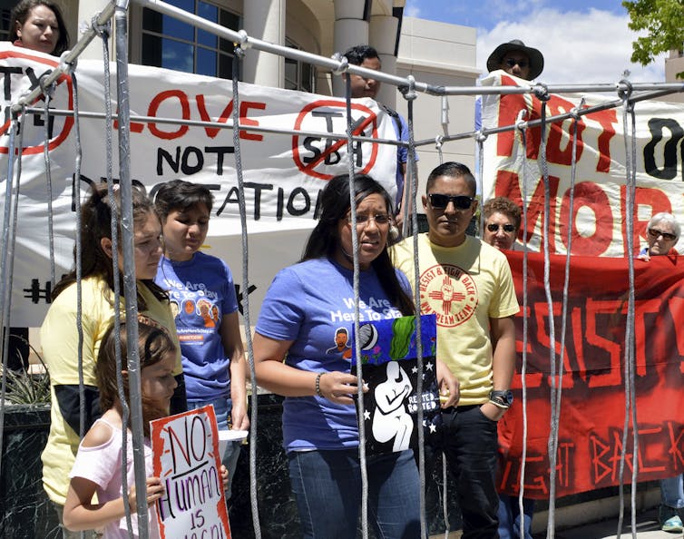 Immigrant rights advocates speak against Trump’s policies in New Mexico.