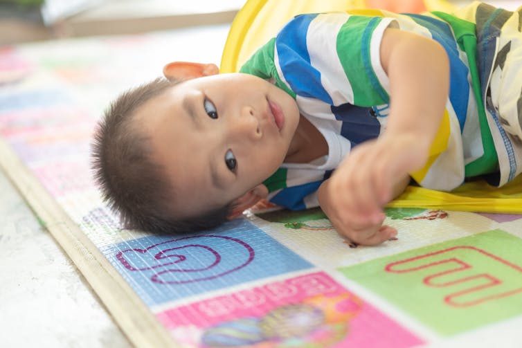Bilingualism and Autism: Can You and Should You? 12 multilingual-child-lying-on-mat