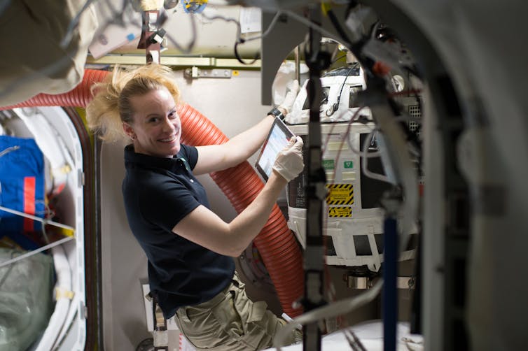 NASA astronaut Kate Rubins works with a Nitrogen/Oxygen Recharge System tank aboard the International Space Station. The tanks are designed to be plugged into the station’s existing air supply network to refill the crew’s breathable air supply. NASA