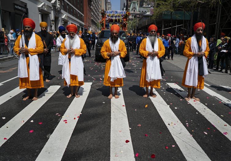 Who are the Sikhs and what are their beliefs?