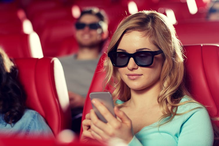 Face it: You can’t watch a movie and text at the same time. (Shutterstock)