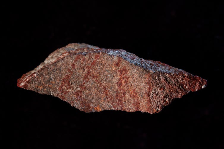'EARLIEST DRAWING'. The drawing found on silcrete stone in Blombos Cave. Craig Foster