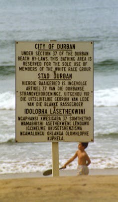 Signage in Durban reflecting apartheid values, 1989