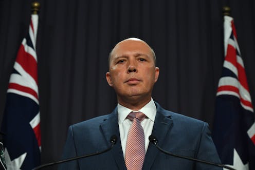 Dutton back in spotlight after split Senate report on au pair affair