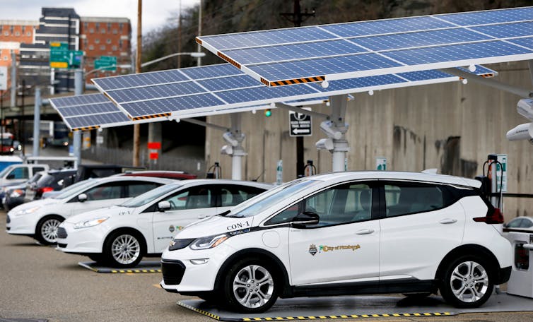 vehicles at solar powered charging station