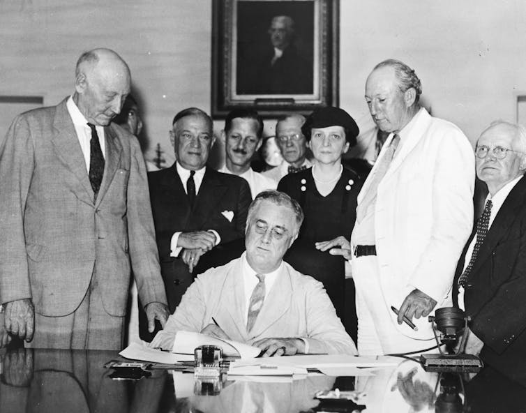 President Roosevelt signing the New Deal