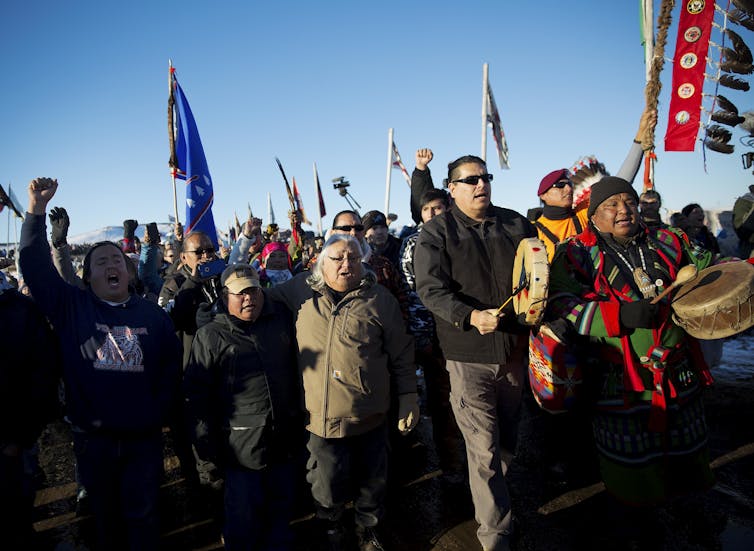 protesters marching with flags