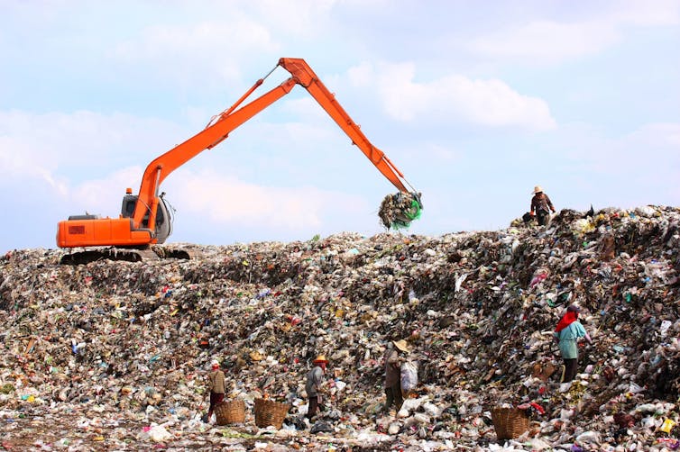 Workers at a landfill site