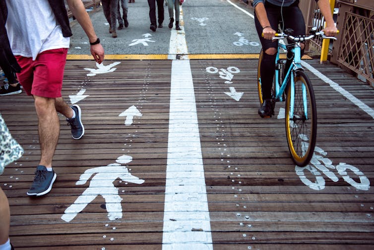 HEALTHY OPTION. Reducing vehicle use by walking or cycling instead could have a major impact on air pollution levels. Nick Starichenko/ Shutterstock