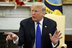 Trump speaks during a meeting with Democratic leaders in the Oval Office of the White House on Dec. 11, 2018.