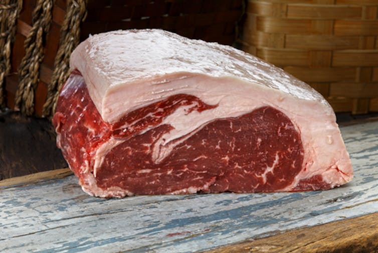 PREFERRED FAT. Studies have shown that humans have a preference for foods that contain fat, such as this slab of steak. Paolo Santos/Shutterstock.com