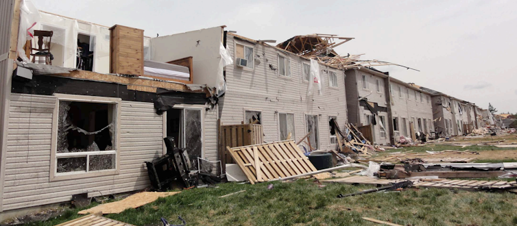 Row of houses damaged by a tornado.