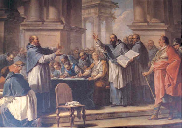 Painting of two men debating. One man is holding a book. They are surrounded by other men watching the discussion.