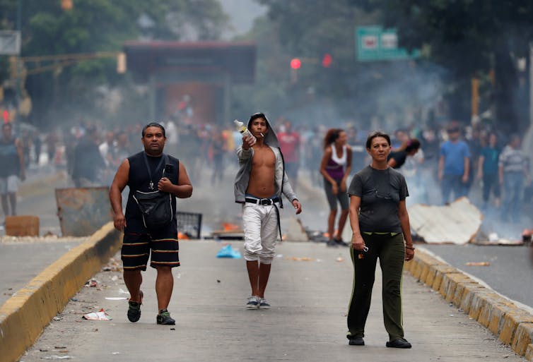Venezuela's power struggle reaches a tense stalemate, as human suffering deepens