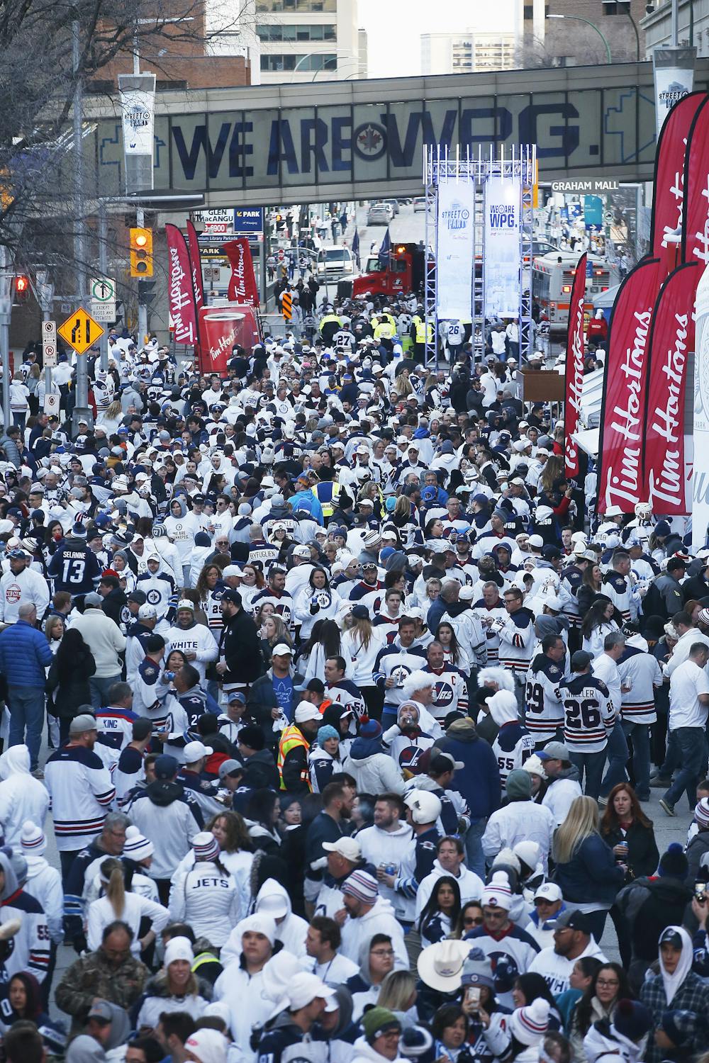 Winnipeg Jets fans get warmed up at the Whiteout Street Party prior to the  second NHL playoff game against the St. Louis Blues during in Winnipeg,  Manitoba, Friday, April 12, 2019. (John
