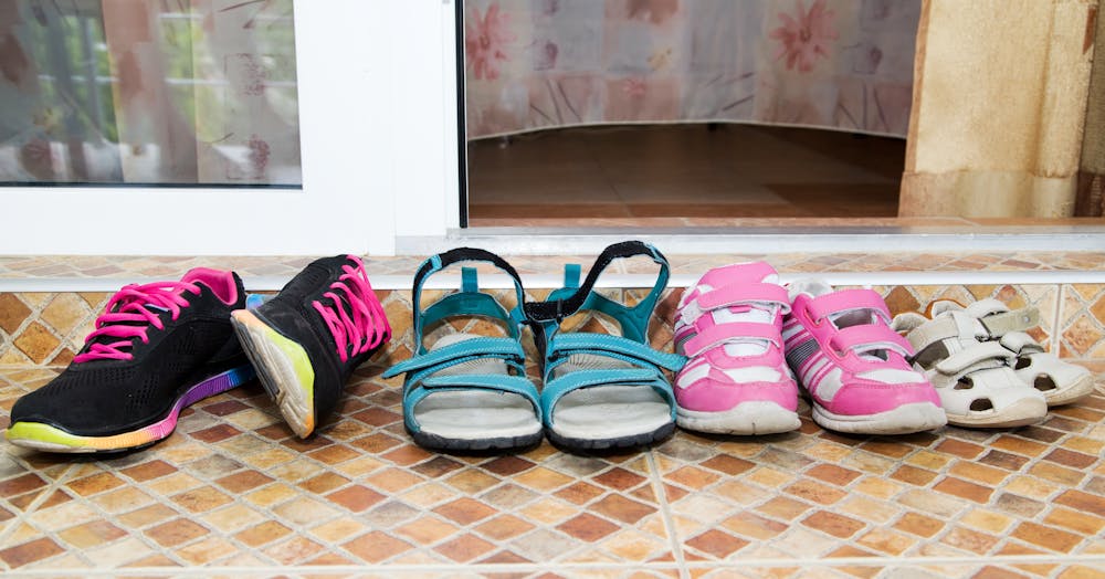 Four pairs of shoes on the floor