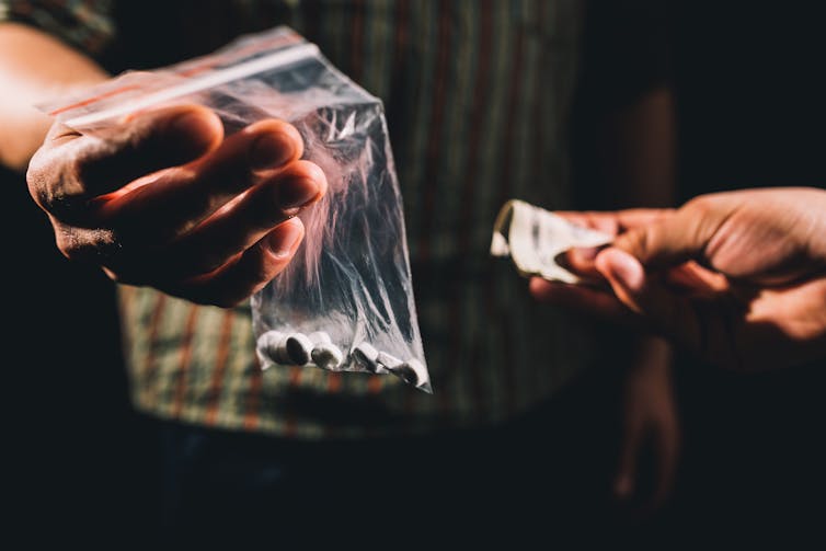 person buying illegal drugs