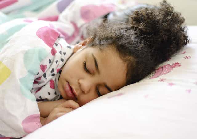 Curious Kids: why don’t people fall out of bed when they are sleeping?