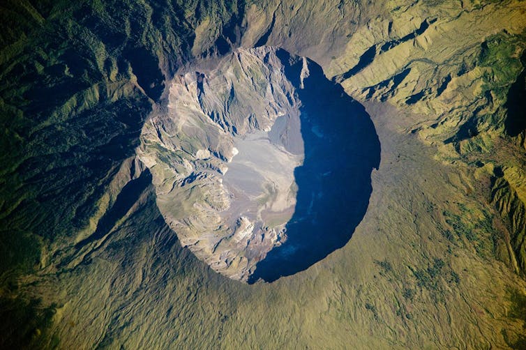 A history of how a silent cosmos led humans to fear the worst: Mount Tambora's crater