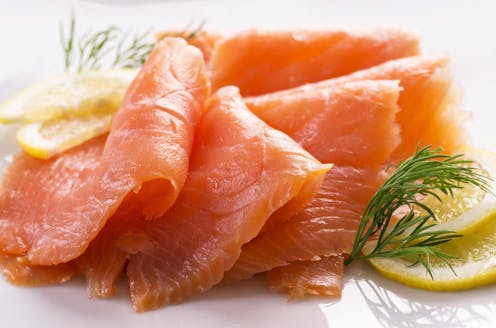 What is listeria and how does it spread in smoked salmon?