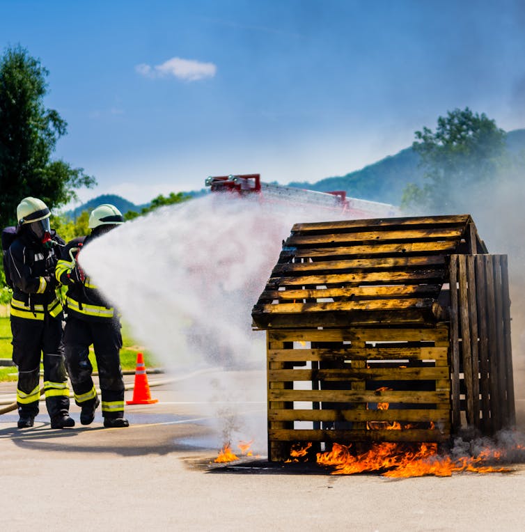 Curious Kids: How does the stuff in a fire extinguisher stop a fire?