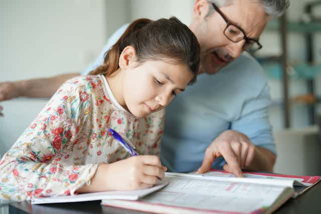 dad helping kid with homework