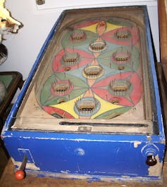 An early pinball machine, before the innovation of flippers to keep the ball in play longer | commons