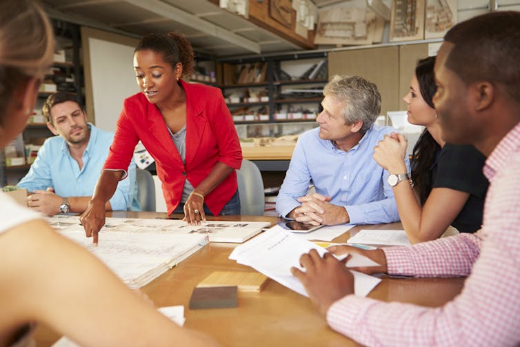 woman of colour talking at business meeting 