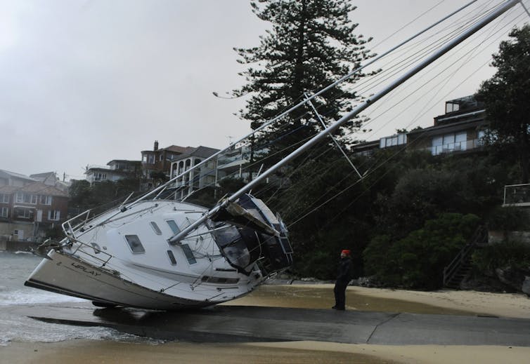 Water may soon lap at the door, but still some homeowners don't want to rock the boat