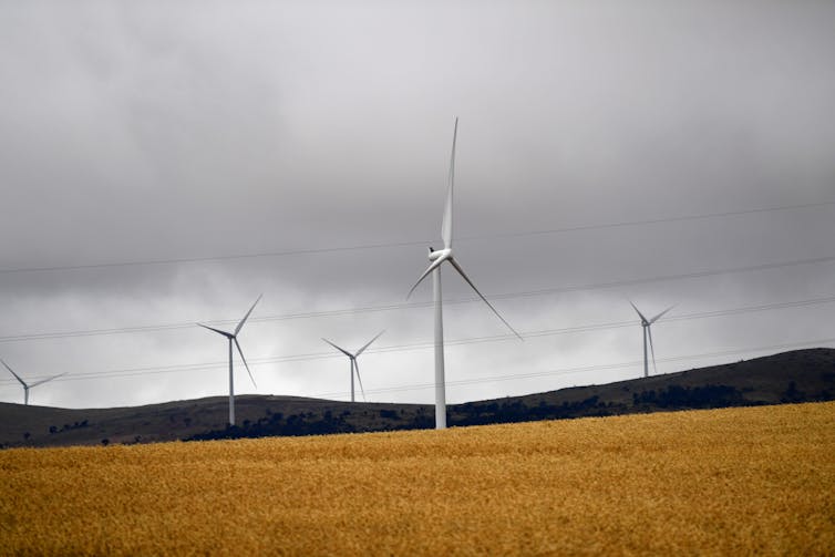Wind turbines adjacent to the Tesla batteries at Jamestown