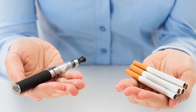  When comparing the dangers of e-cigarettes to cigarettes, some experts believe the health risks of e-cigs are not as serious as those from cigarettes. Andrey_Popov/Shutterstock.com
